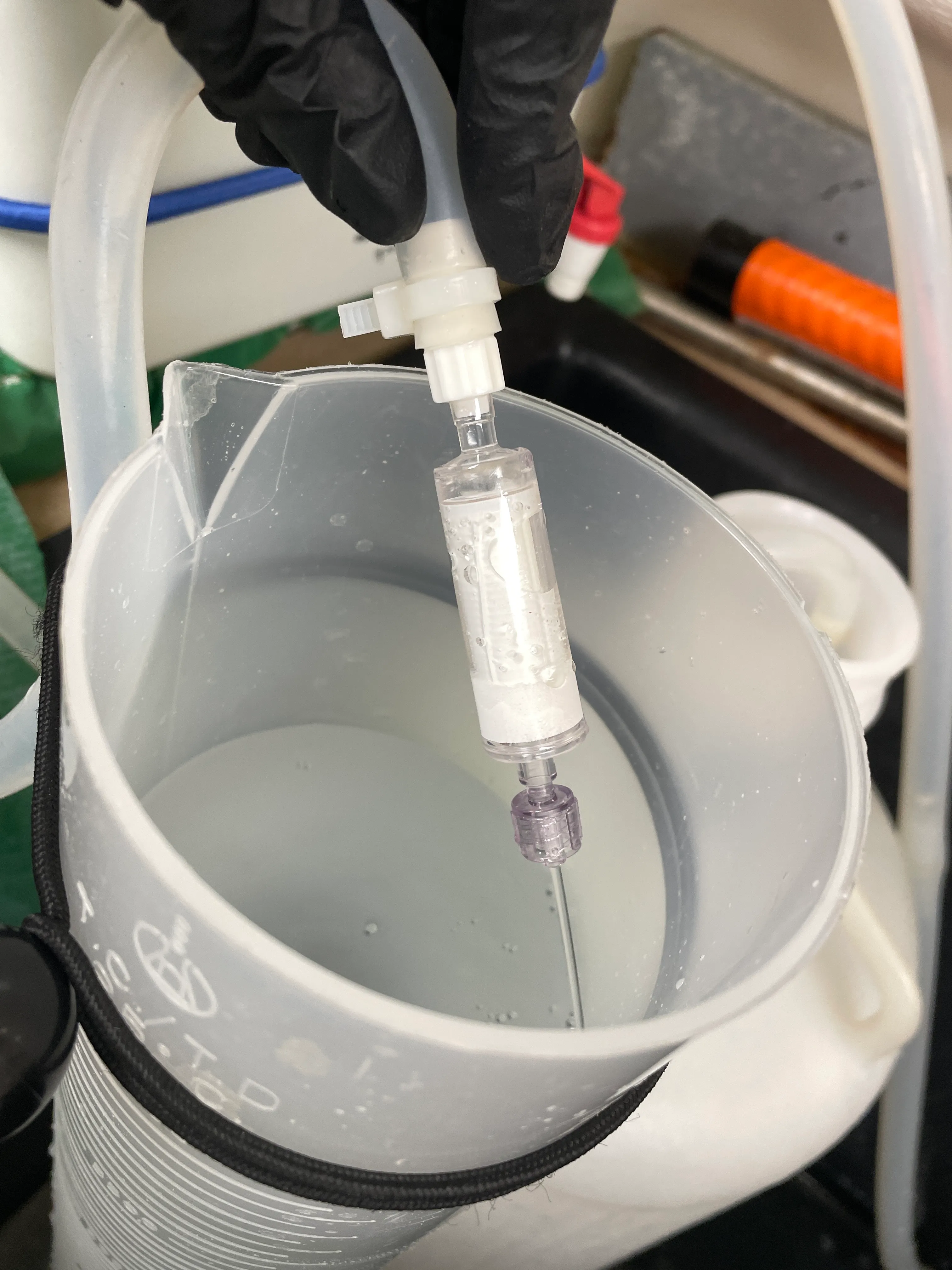 Filtering water through Sterivex for DNA sampling
