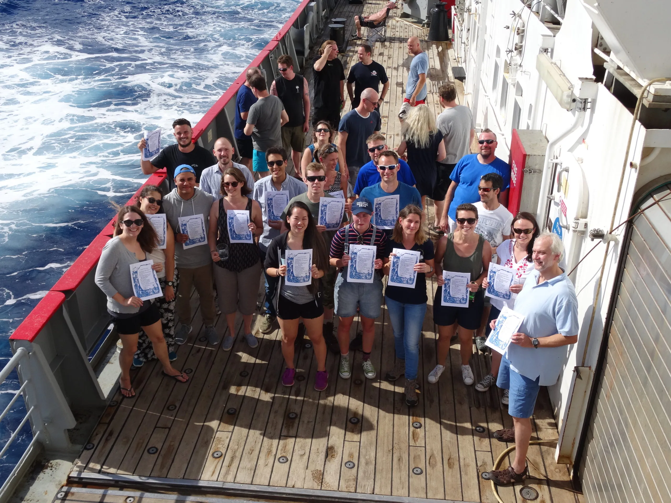 Science team on a ship deck during an equator crossing